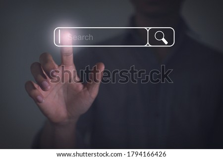 human hand press search button on virtual screen with technology concept. Free space for text or design. Royalty-Free Stock Photo #1794166426