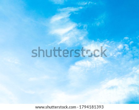 Beautiful blue sky and white clouds of various shapes with sunlight. Nature background Royalty-Free Stock Photo #1794181393