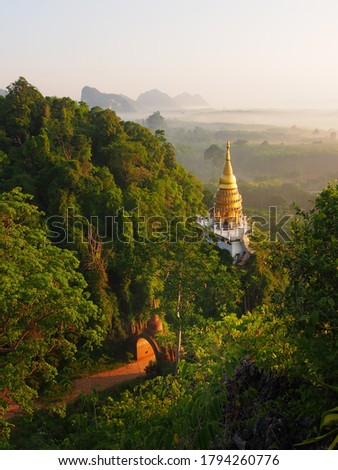 Pagoda on the mountain In a temple At Surat Thani Province Southern Thailand is very beautiful, it is a tourist destination that people who like nature love to take pictures. Soft focus and background