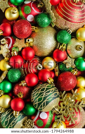 Festive Christmas background. Red, green, golden Christmas toys Overhead shots