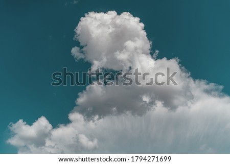 Blue sky with white clouds, image with retro vintage toned filter. Natural background and texture.