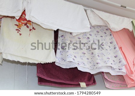 Washed multicolored underwear to dry on ropes