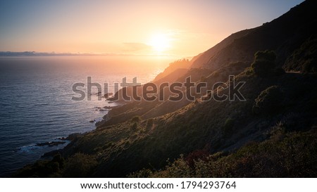 Rugged coastal mountains of Big Sur California at sunset