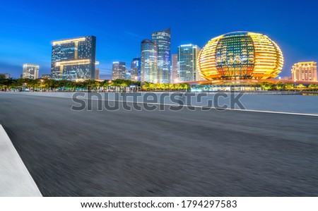 city road through modern buildings in China