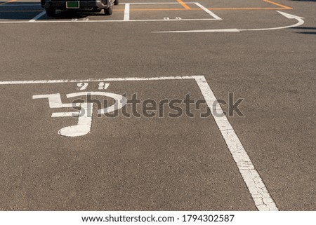 Handicapped symbol / icon on empty space Disabled Parking  reserved for disabled people