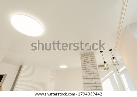 Beautiful built-in lamps in the stretch ceiling