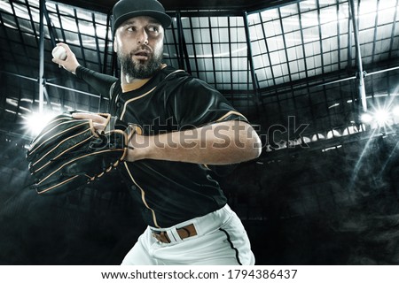 Porfessional baseball player with bat taking a swing on grand arena. Ballplayer on stadium in action.