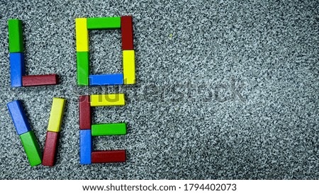 Colourful love letter from Woods toys background