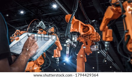 heavy automation robot arm machine in smart factory industrial,Industry 4.0 concept image.