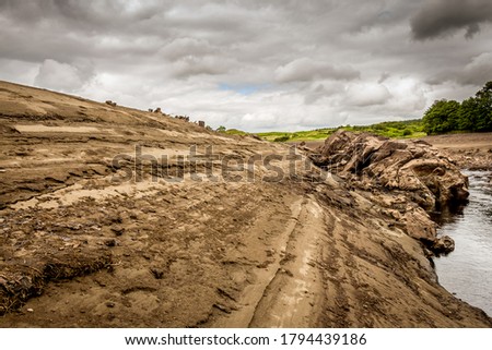 80 years of silt deposits exposed due to Earlstoun Dam and Loch / reservoir being drained for the first time in 80 years, on the Galloway Hydro Scheme, Scotland Royalty-Free Stock Photo #1794439186