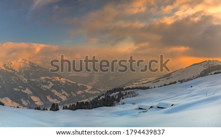 Snowy landscape with house buried in snow during sunset with frozen path Royalty-Free Stock Photo #1794439837