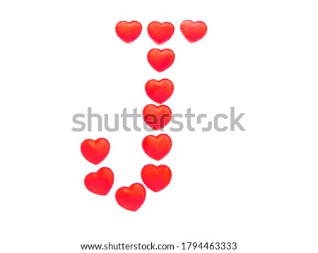 The letter J is made up of small red hearts isolated on a white background. Bright red font.