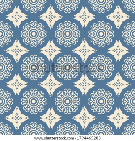 Modern simple flower motif seamless pattern flat vector for wallpaper, packaging and textile. Geometric abstract ethnic mandala repeat pattern for tile on blue color background.