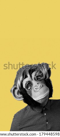 man wearing a monkey mask and a wig, in black and white, on a yellow background with some blank space on top, in a vertical format to use for mobile stories or as smartphone wallpaper