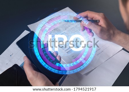 Double exposure of man signing contract with phone and ipo hologram. Concept of initial primary offering, investment.