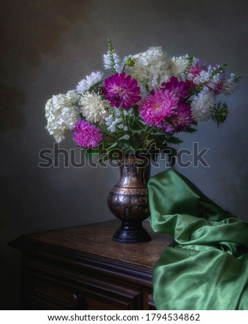 Still life with splendid bouquet of flowers in copper vase
