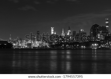 Black and White Nighttime Roosevelt Island and Manhattan Skyline along the East River in New York City