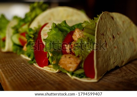 delicious and bright tacos, mexician cuisine, chicken, greens, vegetables, tomatoes