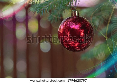 Christmas decoration, bauble ball hanging on fir tree over abstract bokeh background, selective focus