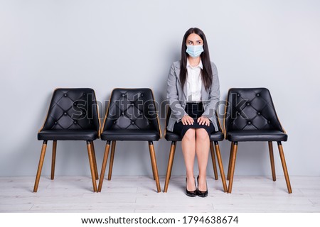 Portrait of her she attractive lady manager sitting in chair wearing safety mask mers cov influenza prevention wait visit doctor clinic test syndrome diagnosis isolated pastel gray color background Royalty-Free Stock Photo #1794638674