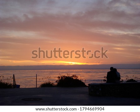 couple at sunset by the beach