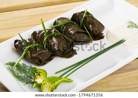 Tasty  grape rolls made from grape leaves, dish of Bulgarian cuisine Sarni at plate