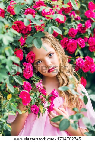 portrait of a young girl in roses.