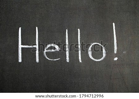 Greeting chalk hello white text on black background. Word welcome horizontal concept hi message sign. Hallo isolated chalkboard design. Blackboard photography communication. English hey speech