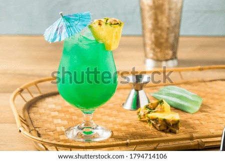 Boozy Refreshing Blue Hawaii Cocktail with PIneapple and Curacao