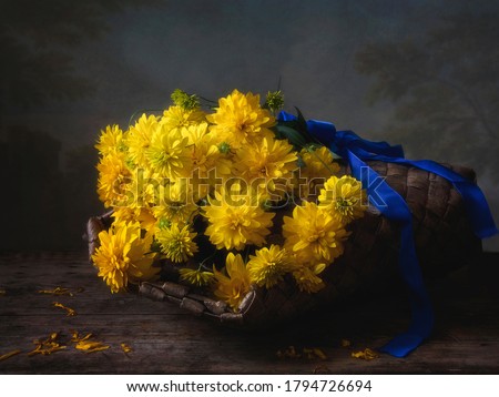 Bouquet of yellow flowers on blue background