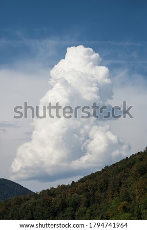 Closeup of cumuli nimbus before the storm on mountain landscape background Royalty-Free Stock Photo #1794741964