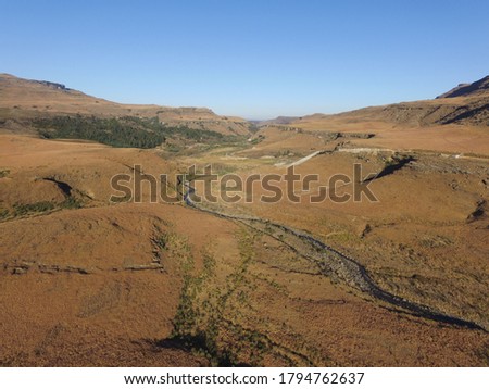 Aerial photo of mountains in the rural Sani Pass area with no people showcasing the vast landscape