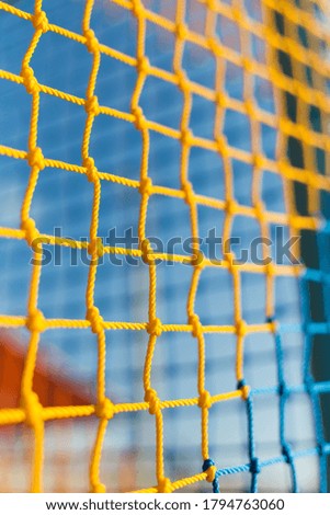 Kids Playground Safety Color Net. Texture of yhe Mesh Fence on the Playground