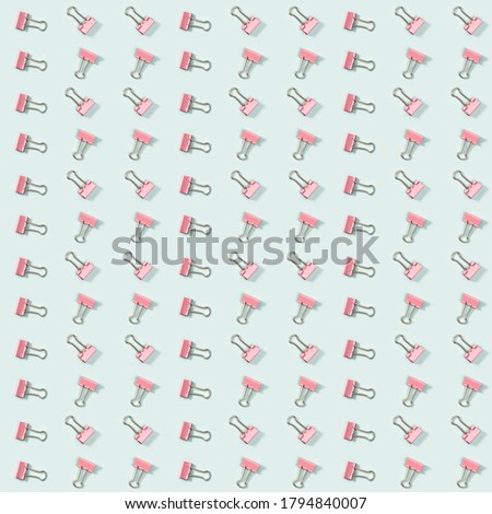 Creative seamless pattern with office supplies, golden metal paper clips. School and education concept. Printing on fabric, wrapping paper.