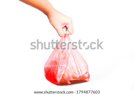 A picture of plastic bag with food and drinks inside on isolated white background. Plastic usage in Malaysia increase drastically and main cause of earth pollution.