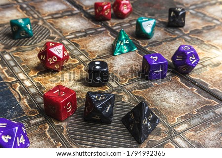 Set of role playing dice on a gaming mat.  Royalty-Free Stock Photo #1794992365