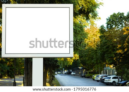 blank white billboard on the street. outdoor advertising, big board with city background.
