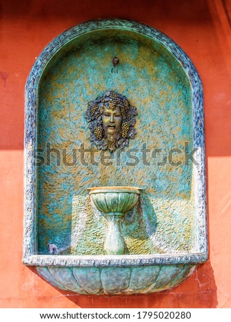 Poseidon god statue in vineyard 