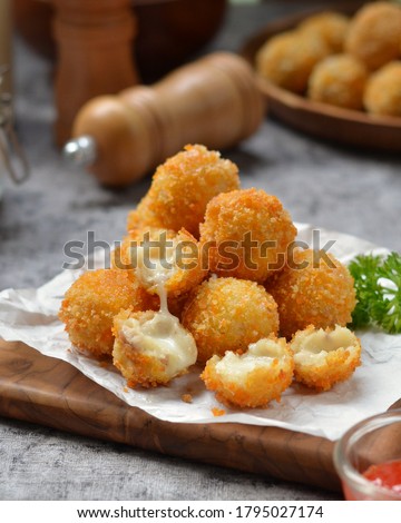 bitterballen is made from a round shaped dough filled with mozzarella cheese, dipped in egg beaten and covered in panir flour and then fried until cooked. Royalty-Free Stock Photo #1795027174