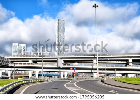 freeway intersection in modern city landscape against downtown skyline background. Street view of urban transportation infrastructure in Moscow city Russia. 3rd ring highway multi storey intersection