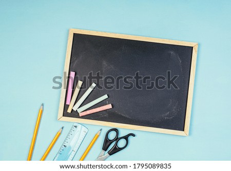 Back to school chalk board, writing with chalk on a black board