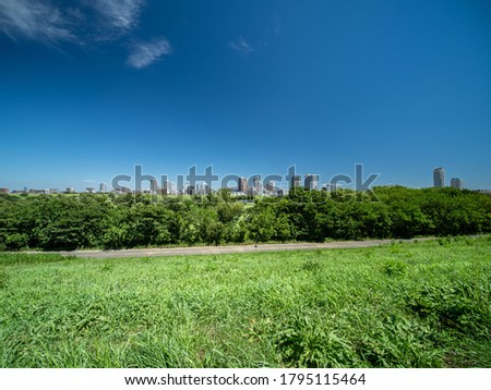 A view of Akabane, Tokyo, with its blue summer sky. The city of Kawaguchi, Saitama Prefecture, can be seen in the background. Royalty-Free Stock Photo #1795115464