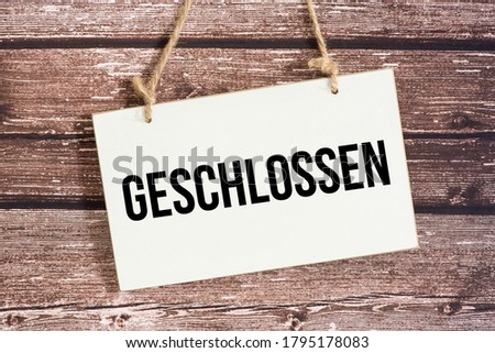 A sign and German translation for closed