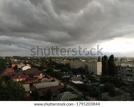 Dark storm clouds over the city