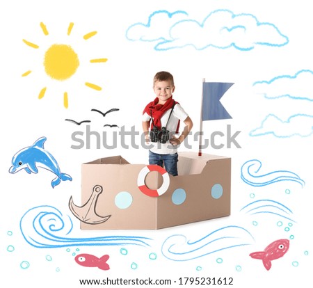 Cute little boy playing in cardboard ship on white background with illustrations