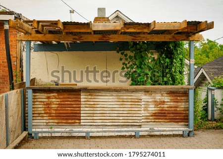 Believed to be a slowly decaying patio bar 