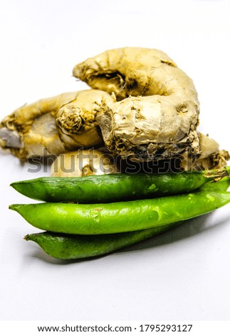 A picture of ginger and pea on white background