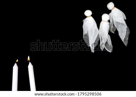 Halloween crafts, ghost with candles isolate on black background with copy space for text. halloween concept. idea for creativity, blank, Top view, flat lay