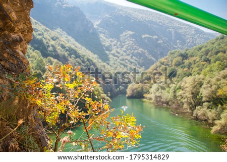 Colorful lake in canyon matka with an amazing view and sunshine.