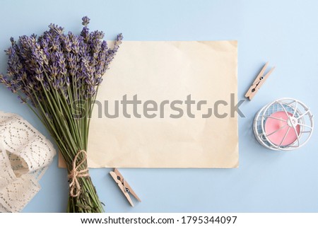 Blank sheet on top of the table lavender, candle, lace